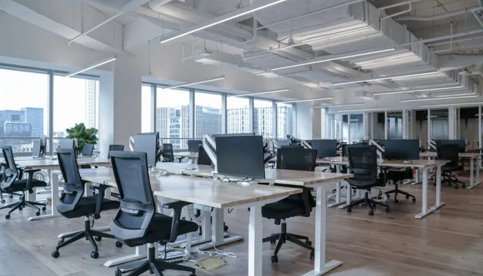 A nicely lit up office with an open floor plan. 