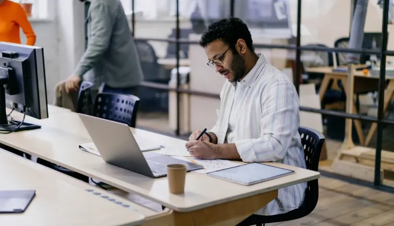 A person doing a training on their laptop. 