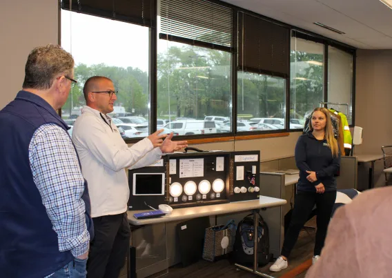 Lighting professionals giving a demonstration on LLLCs. 