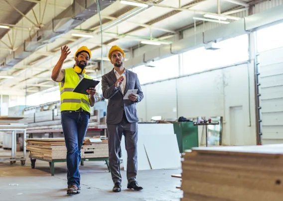 two workers looking at lighting