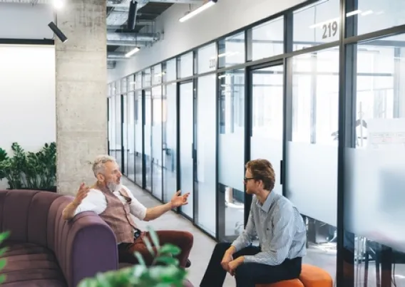 two people talking in an office