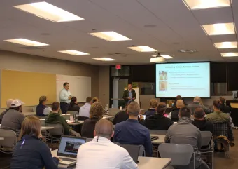 A room full of attendees at a LLLC training event. 