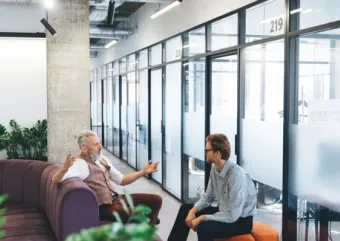 two people talking in an office