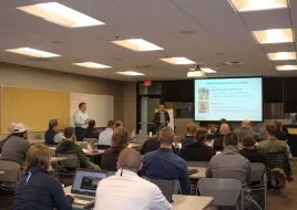 A room full of attendees at a LLLC training event. 